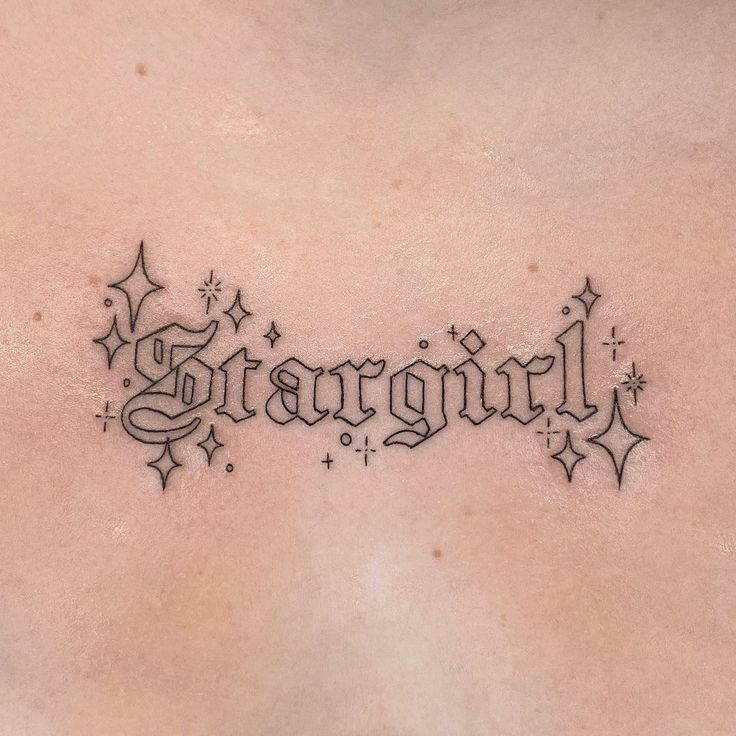 a tattoo with the word stargirl written in cursive writing and stars around it