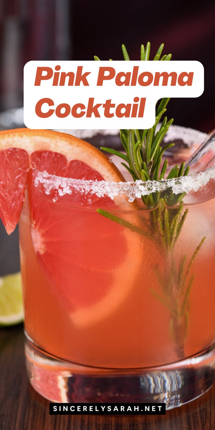 the pink paloma cocktail is garnished with rosemary