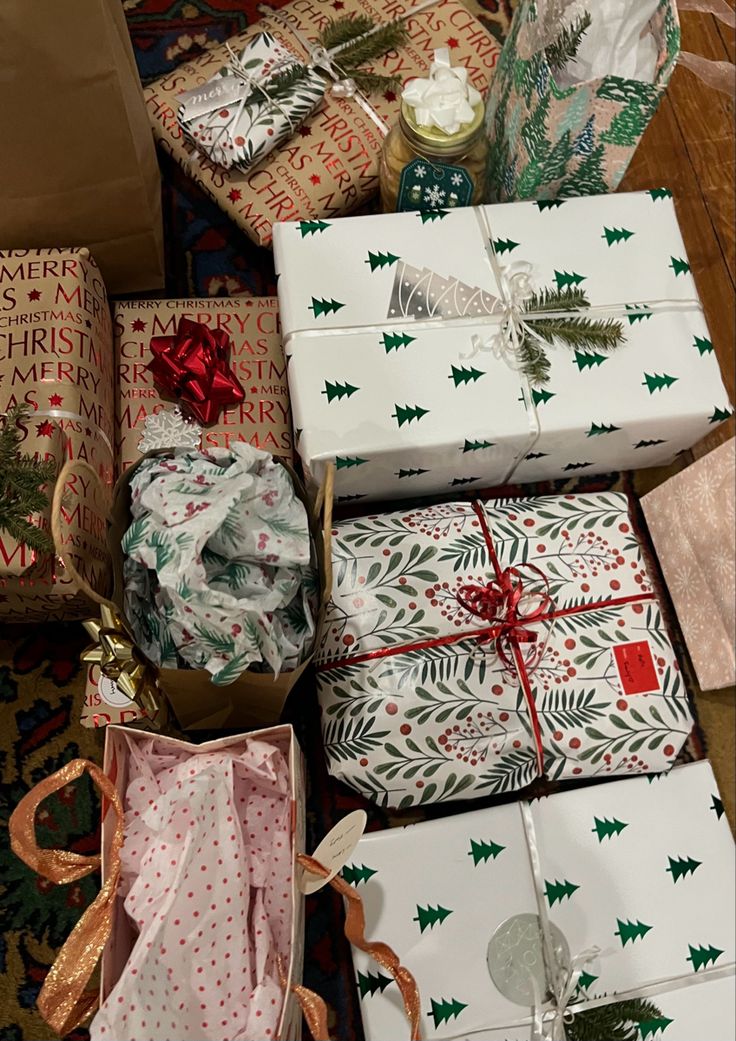 several wrapped presents sitting on the floor next to each other