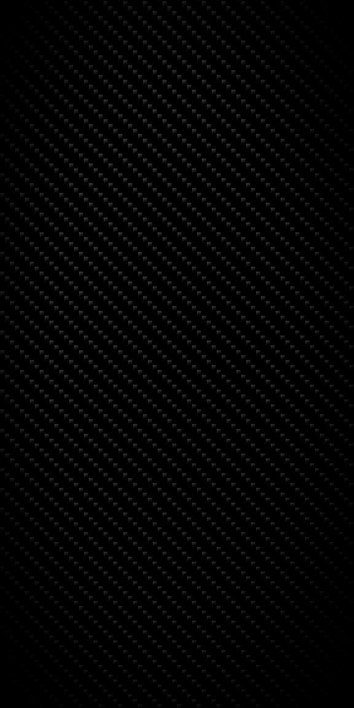 the black background is very dark and it looks like carbon fiber textured paper, which can be used as a backdrop or wallpaper