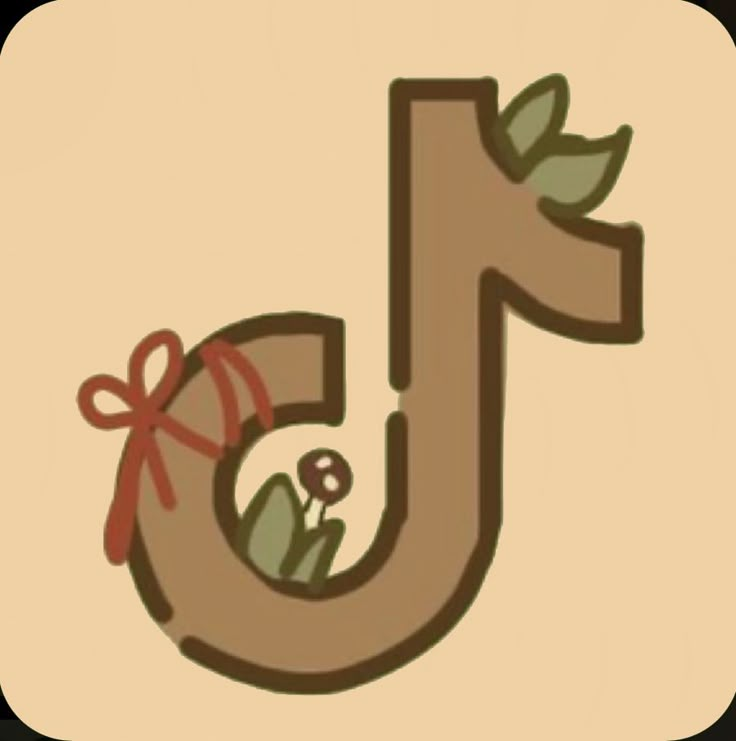 the letter j is decorated with flowers and leaves on it's side, as well as a bow