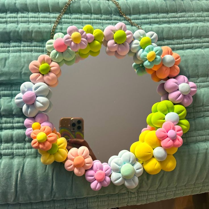 a mirror that has some flowers on it