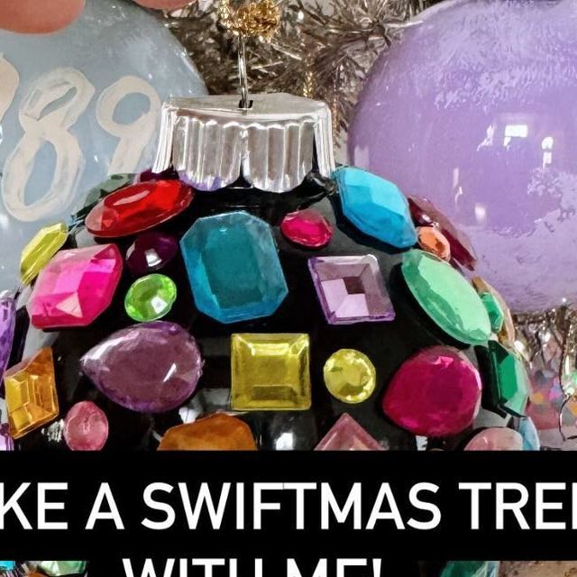 a christmas ornament that has been decorated with different colored jewels and words on it