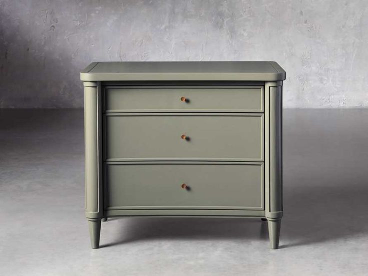 a white dresser with three drawers on one side and an open drawer on the other