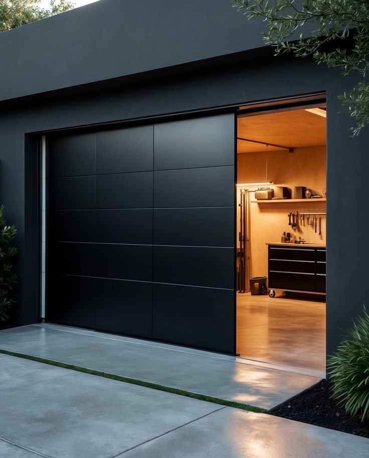 an open garage door with the lights on