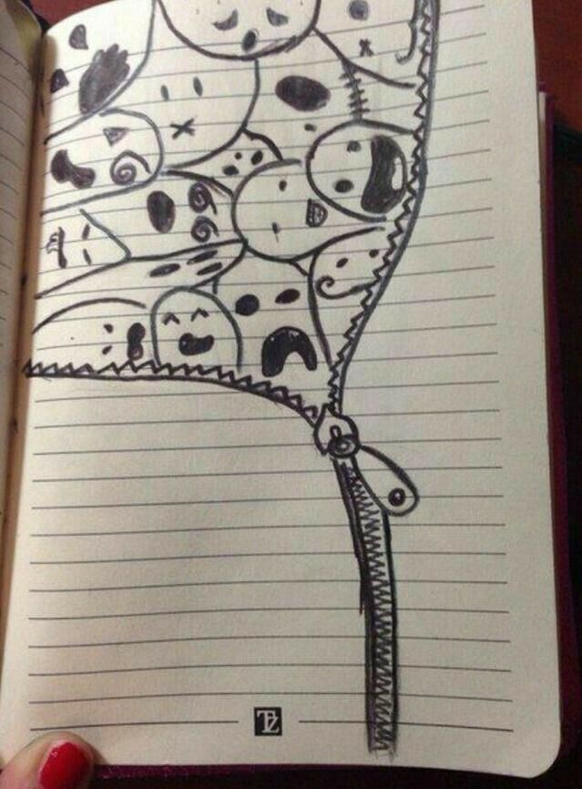 an open notebook with some drawings on it