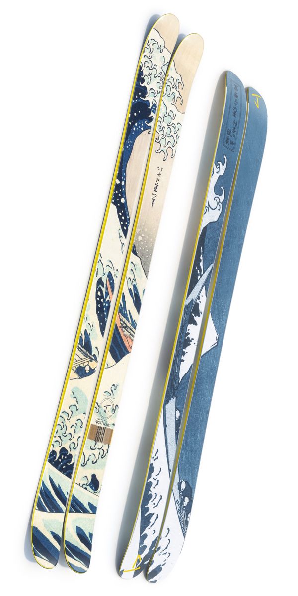 two snow skis sitting next to each other