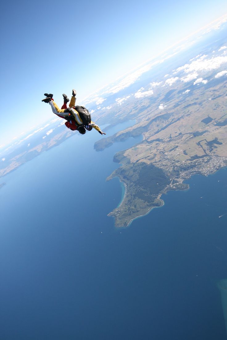 a man is in the air with his parachute