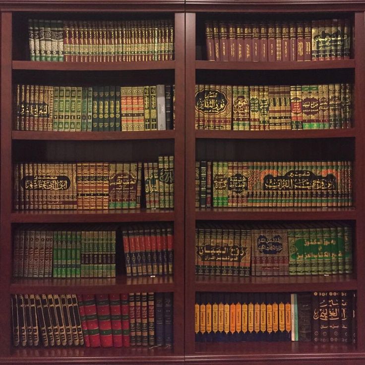 an old bookcase with many books on it