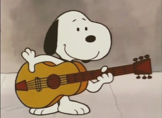 a cartoon dog playing an acoustic guitar