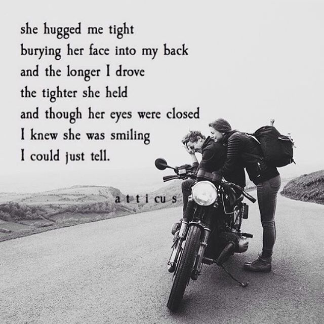 a woman standing next to a motorcycle on the side of a road with a poem written in black and white