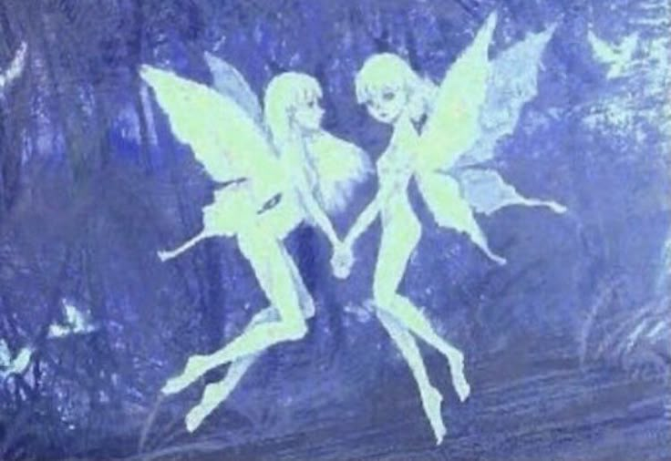 two fairy tinkerbells holding hands in front of a blue background with trees