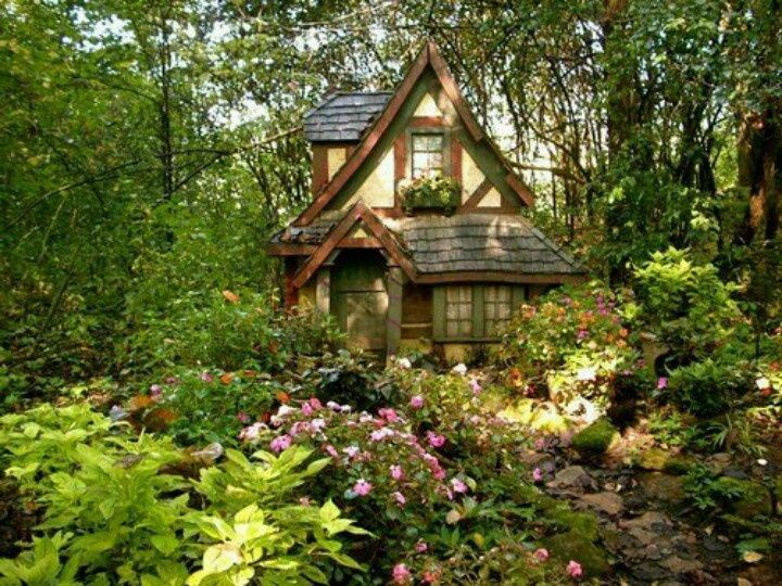 an image of a small house in the middle of some flowers and plants on facebook