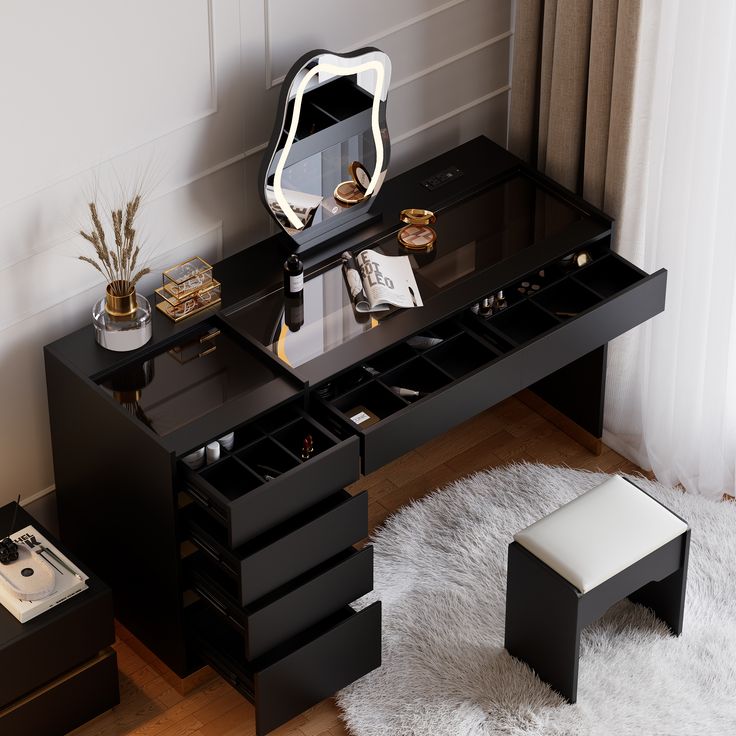 a black desk with drawers and a mirror