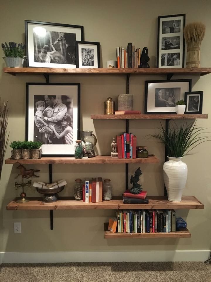 some shelves with pictures and books on them