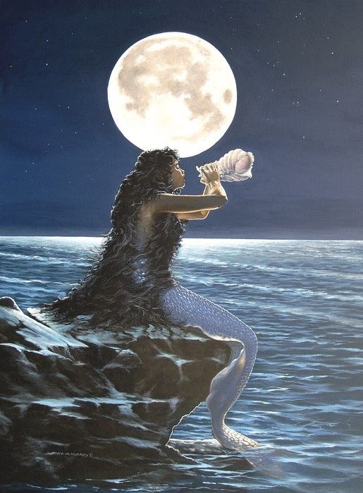 a woman sitting on top of a rock next to the ocean under a full moon