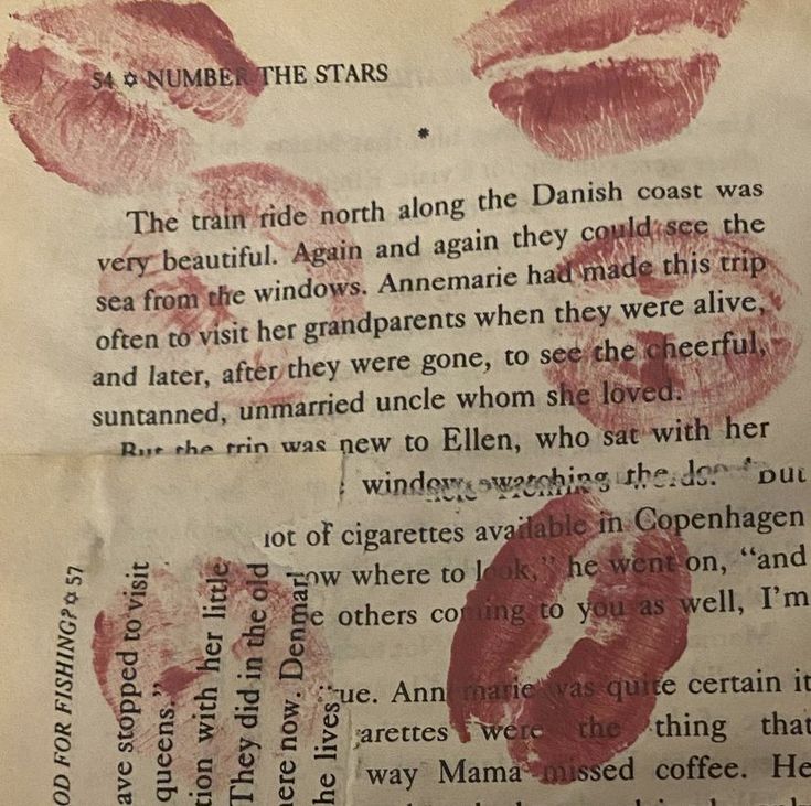 an old book with red lipstick on it