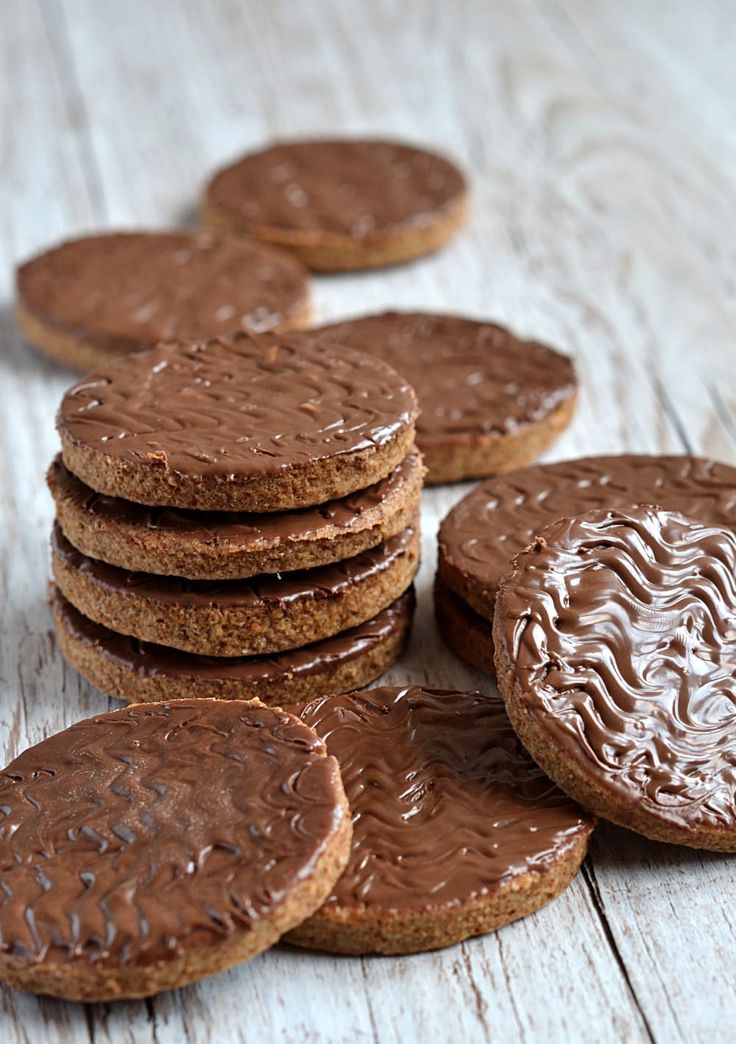 cookies with chocolate frosting sitting on top of each other