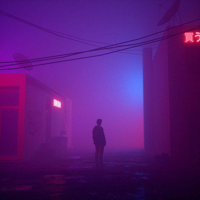 a person standing in the fog near some buildings