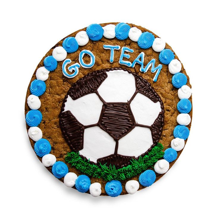 a cookie decorated like a soccer ball with the word go team written on it and blue icing