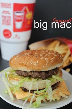 a hamburger with lettuce and cheese on a plate