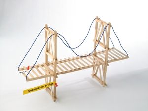 a small wooden bridge with a rope attached to it