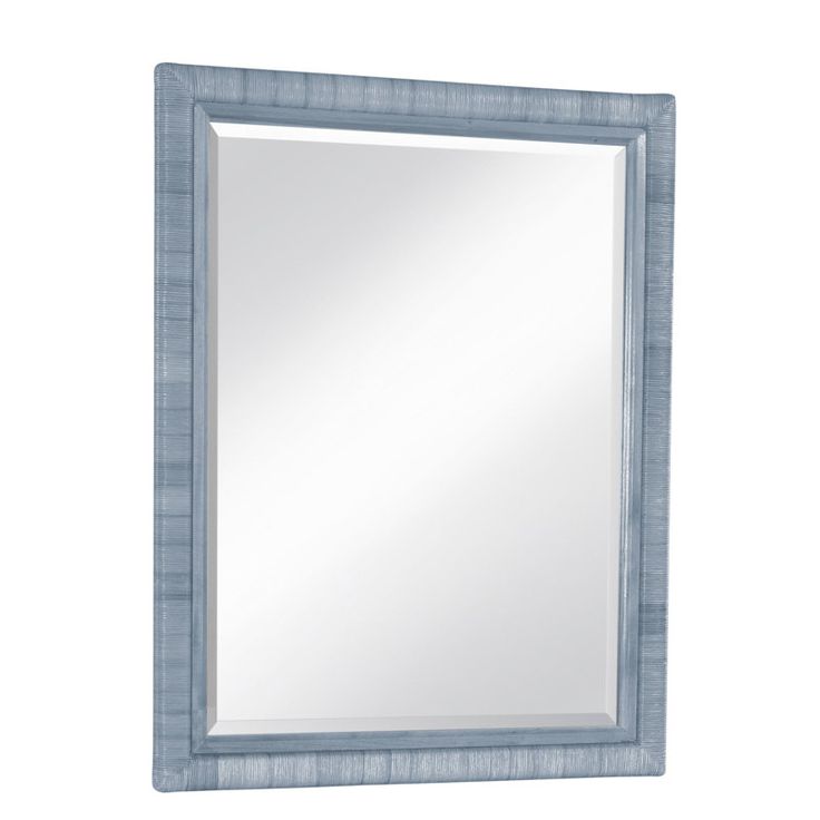 a blue framed mirror on a white wall