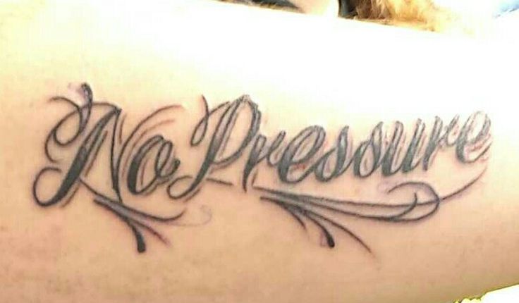 a woman with a tattoo on her arm that says no pressure