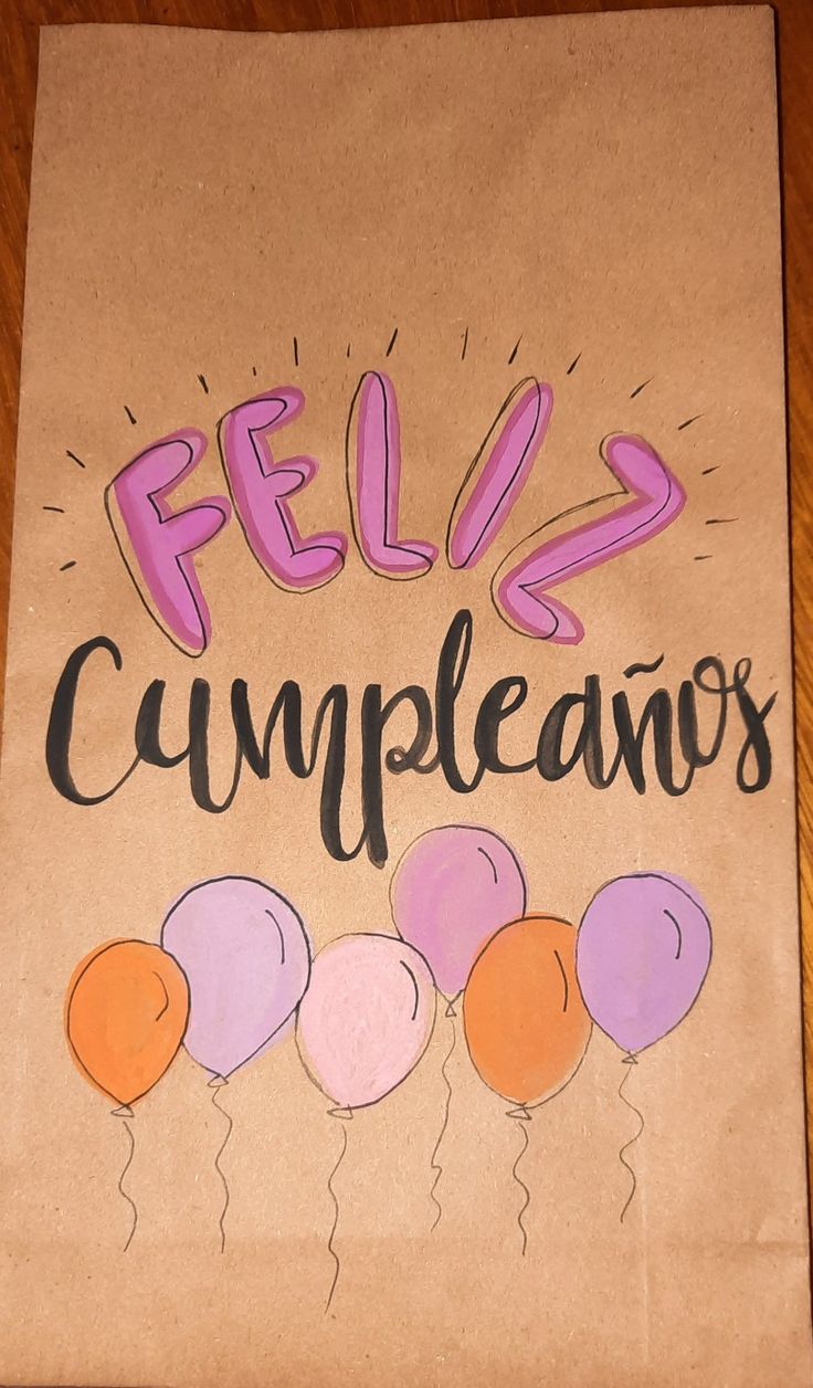 a piece of paper with the words feliz cumpleanos written on it