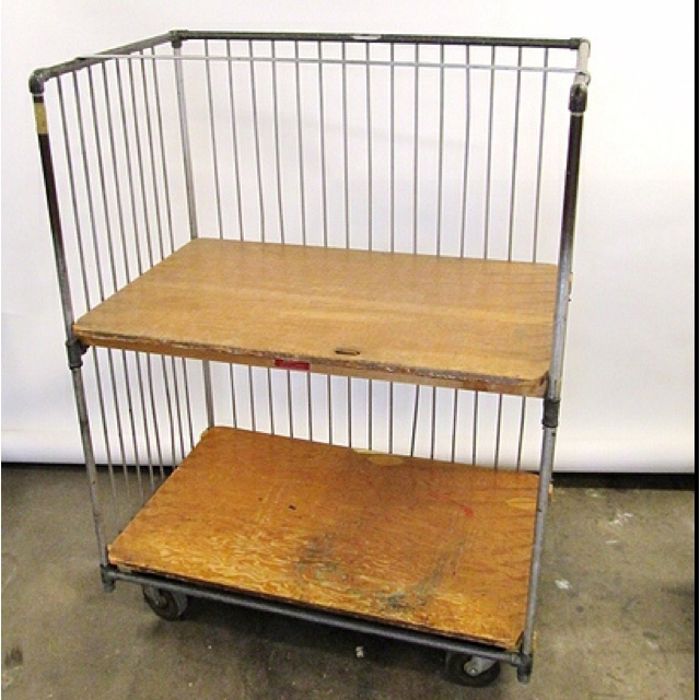 a metal and wood cart with two shelves