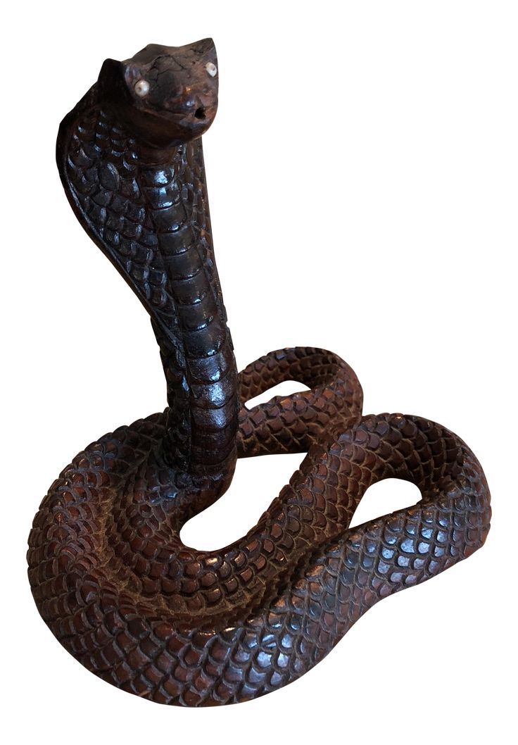 a statue of a snake on a white background