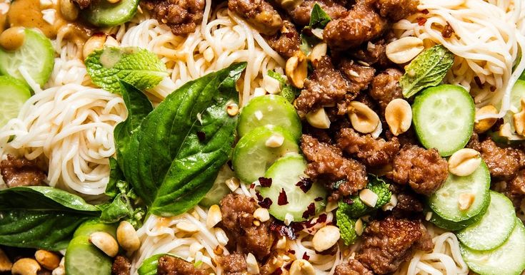 noodles, meat and vegetables are mixed together