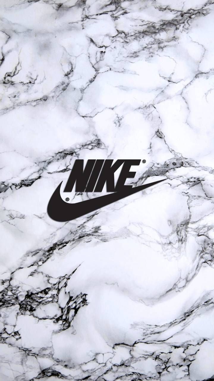 the nike logo is displayed on a marble surface with black and white swirls around it