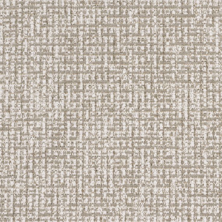 an upholstered beige and white fabric textured with small squares on the surface