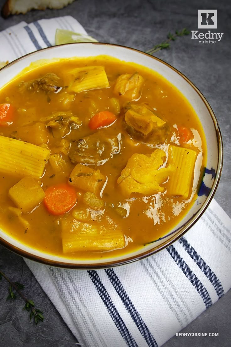 a bowl filled with vegetable soup on top of a table