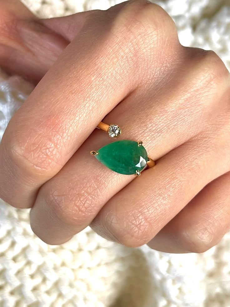 Natural Emerald With Natural Diamond 14k Solid Gold (Rose Gold (RG), and Yellow Gold (YG), White Gold (WG) are Available) ✦ Approximate Emerald Dimension: 8.5mmx13.5mm ✦ Approximate Round Diamond Dimension: 2.5mm ✦ Approximate Emerald carat weight: 2.30Ct ✦ Approximate Diamond carat weight: 0.06Crt ✦ Approximate Ring width: 2.20mm Add Some Extra Shine to your look with this EMERALD and DIAMOND ring. This 2stones ring can be worn on any finger for a stylish, sophisticated accessory to any outfit. Unique Emerald Ring, Pear Emerald Engagement Ring, Diamond Ring With Emerald Accents, Unique Emerald Engagement Rings, Jade Ring Engagement, Eclectic Engagement Rings, Emerald Ring Design, Jade Engagement Ring, Emerald And Diamond Engagement Ring