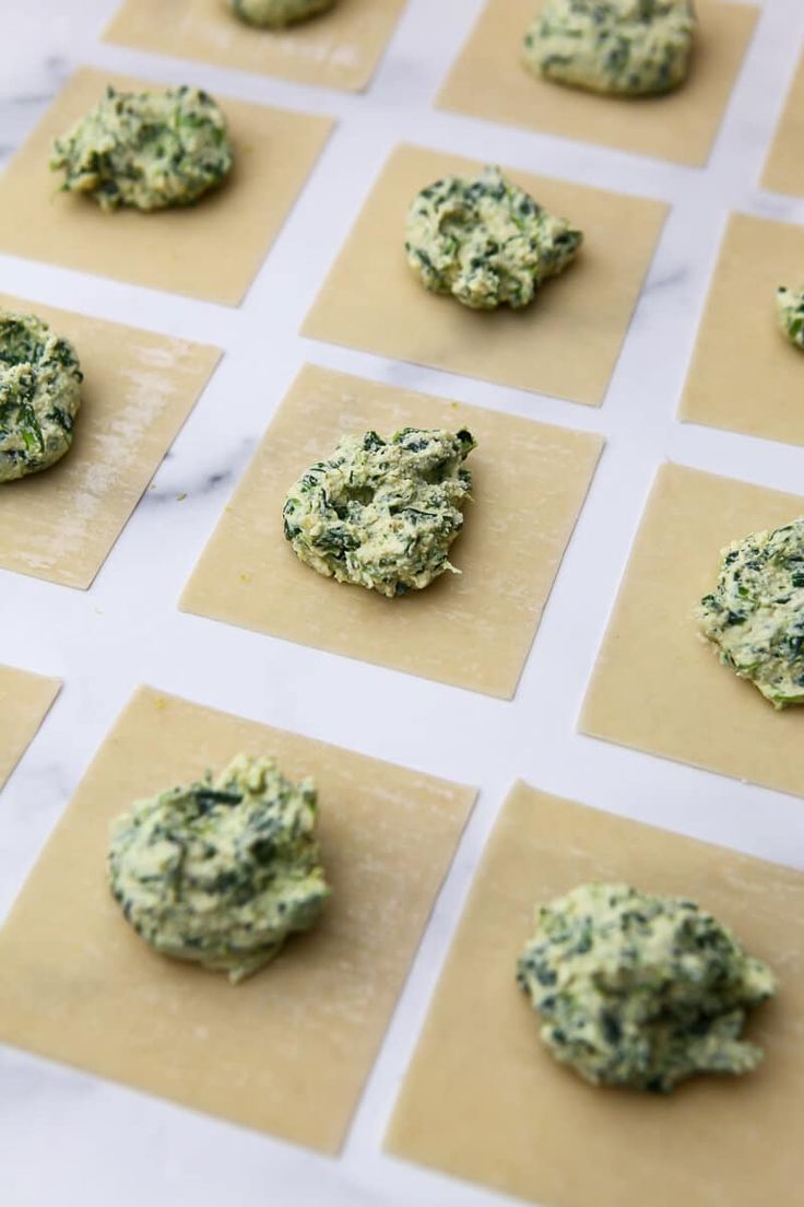 small cookies are arranged on top of some brown paper and laid out in squares to make them look like they have been made with spinach