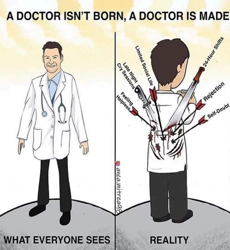 a doctor is holding scissors in his hand and pointing at the other man's head