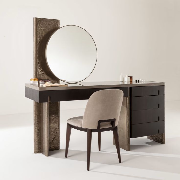 a vanity with a mirror and chair in front of it