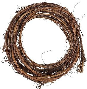 a round wreath made out of twigs on a white background