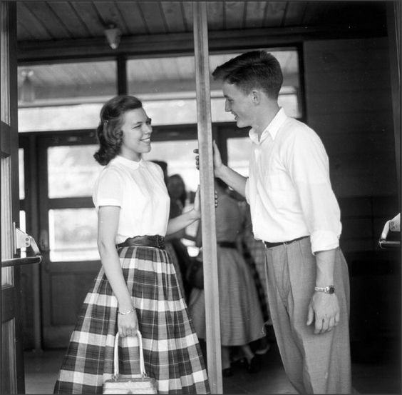 a man and woman standing next to each other