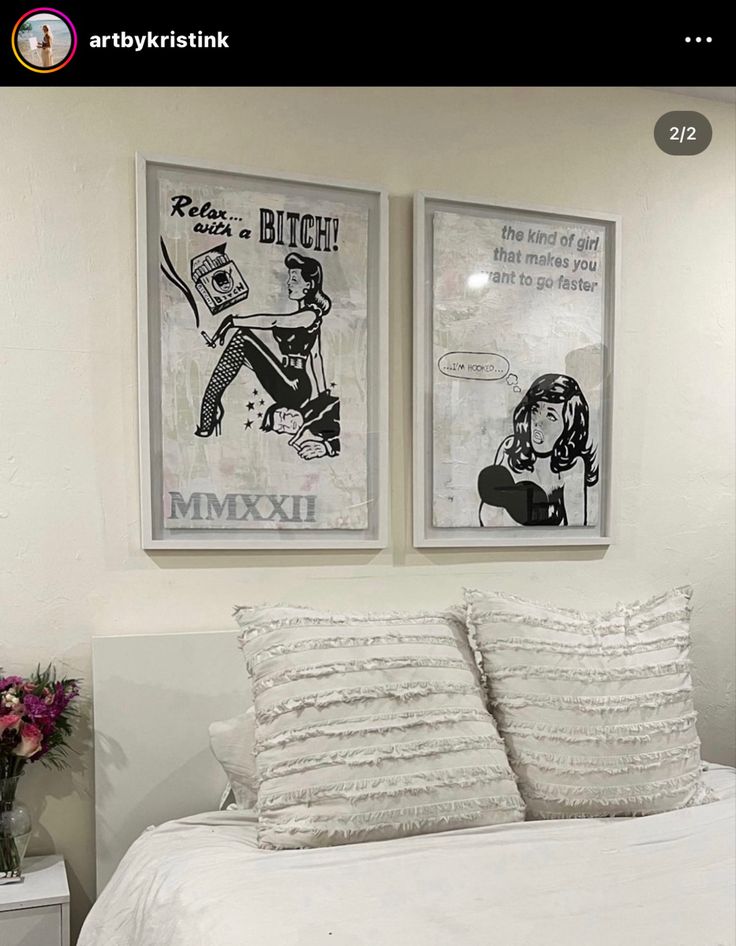 two pictures hang on the wall above a bed in a room with white sheets and pillows