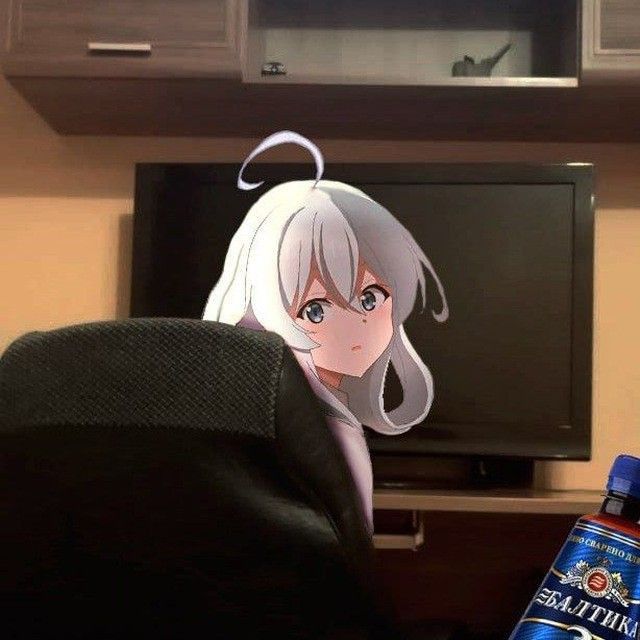 an anime character sitting in front of a tv