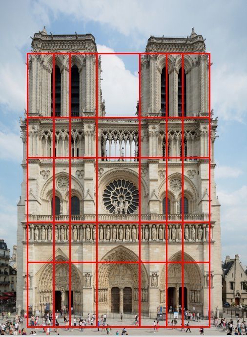 a large cathedral with red squares in front of it