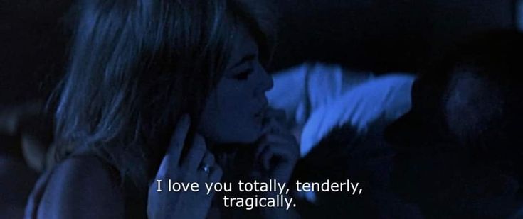 a woman talking on a cell phone next to a man in the dark with a caption that reads, i love you totally, tenderly, tragially