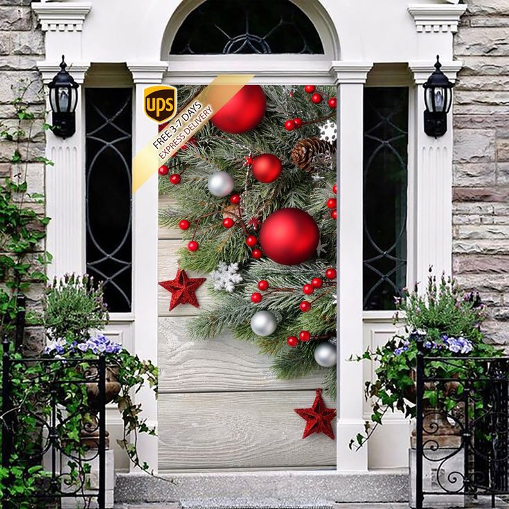 a christmas tree decorated with red and silver baubes is on the front door