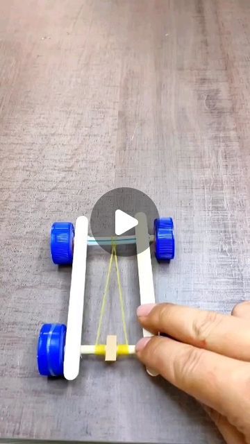 a person is playing with a toy skateboard