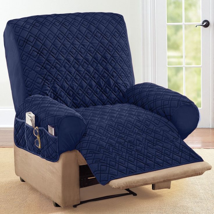 a recliner chair with a blue quilted cover on it