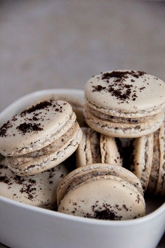 a white bowl filled with cookies on top of a table