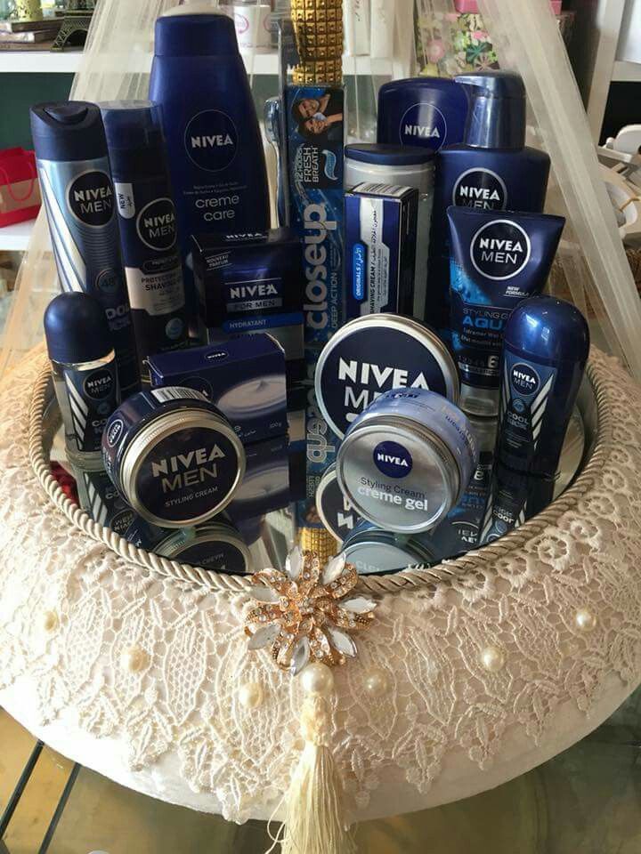 an assortment of men's grooming products in a basket on top of a table